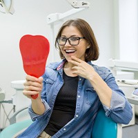 Woman happy with her smile after a checkup