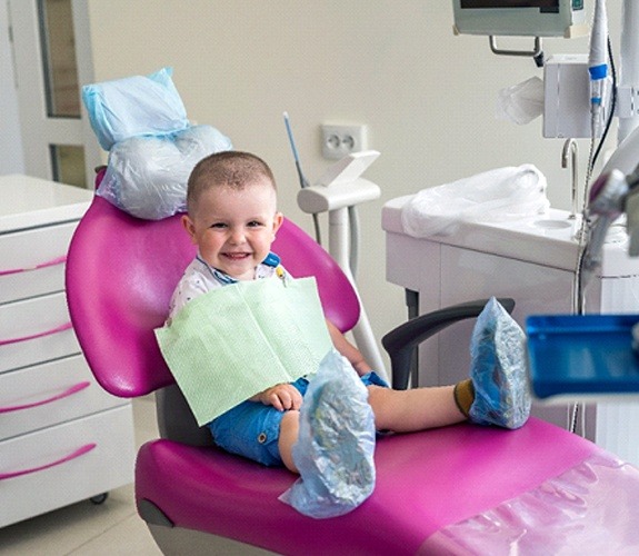 Young boy and mother brushing teeth at Age One Visit in Lockport, IL