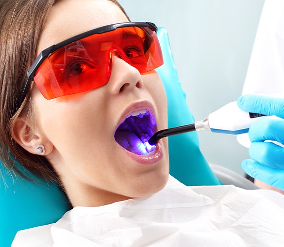 Patient receiving dental sealants