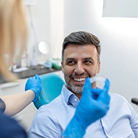 Man meeting with a dentist for a follow-up appointment