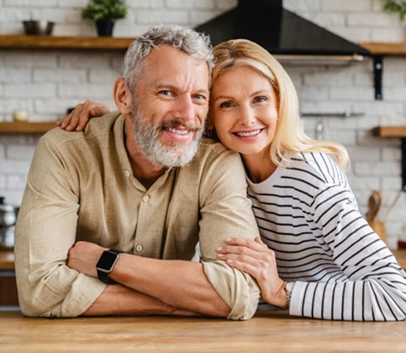 Couple smiling with dentures in Lockport 