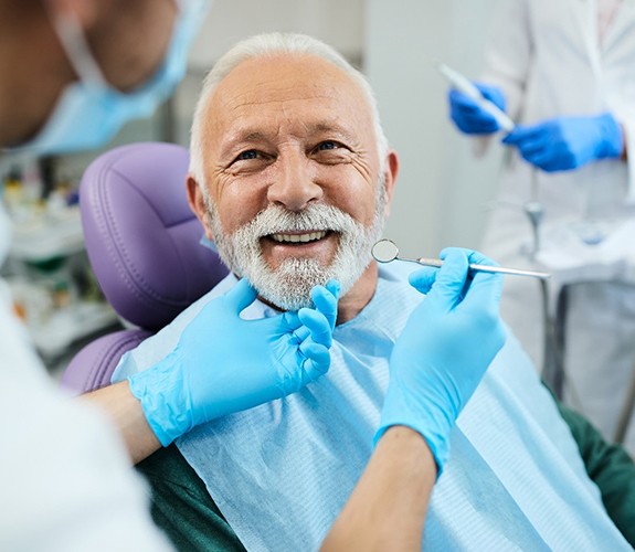 Man after learning how dentures are made in Lockport