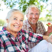 People eating with dental implants in Lockport