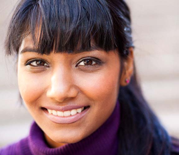 Teenage girl smiling after Invisalign Teen in Lockport, IL