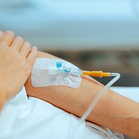 An IV in a person’s arm