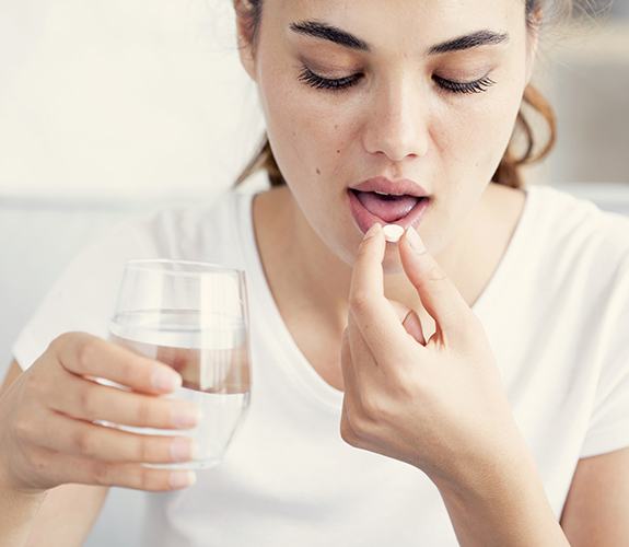 Woman taking oral conscious sedation in Lockport