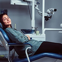 Woman seated in a treatment chair and drowsy