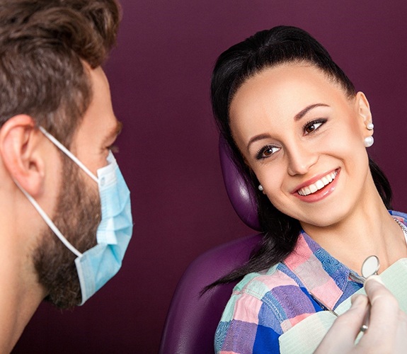 Patient asking questions about gum disease therapy in Lockport