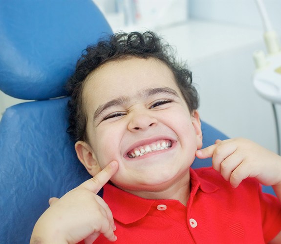 Child smiles after Phase 1 orthodontics in Lockport, IL