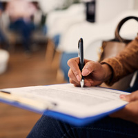 Person filling out paperwork 
