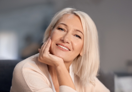 Woman with healthy smile after gum disease treatment