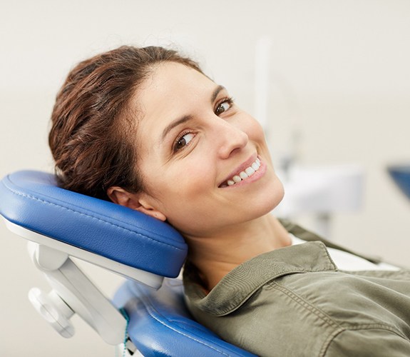 Patient smiling while at appointment for soft tissue laser dentistry