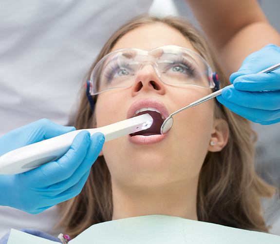 Dentist using intraoral camera to capture images