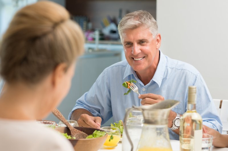 man eating with dentures