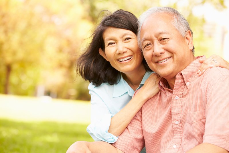 couple with dental implants