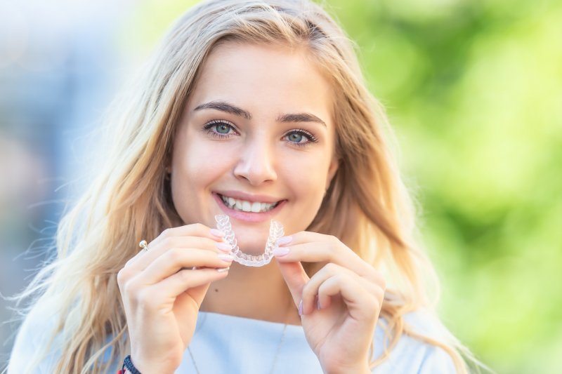 teenager with Invisalign clear aligners