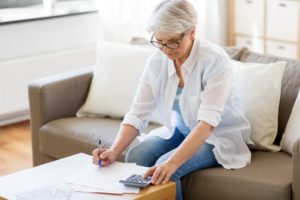 Woman researching dental insurance in Lockport