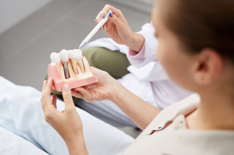 patient learning about dental implants