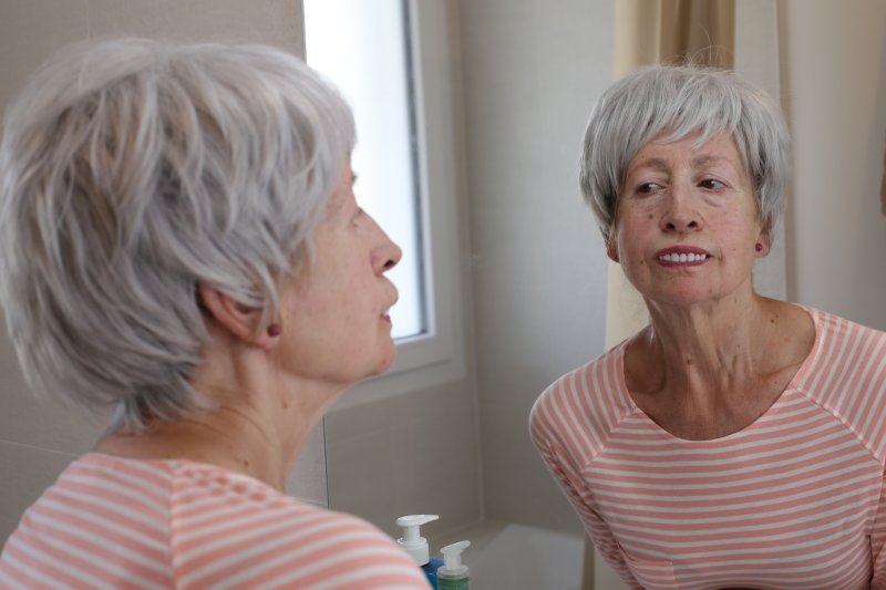 woman with ill-fitting dentures