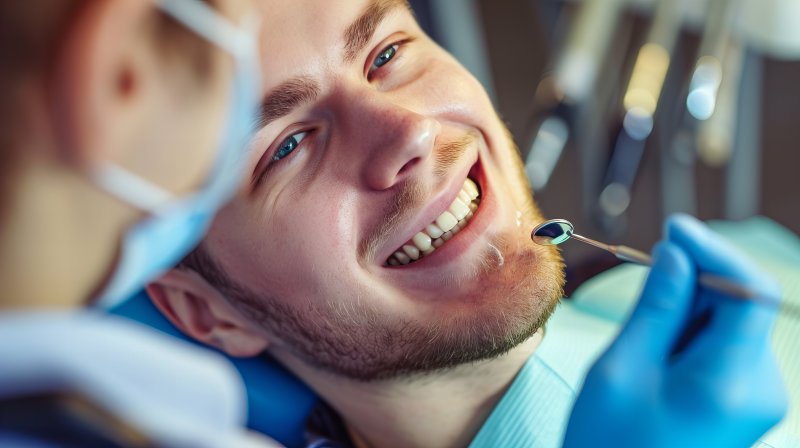 young man receiving checkup for cosmetic dentistry