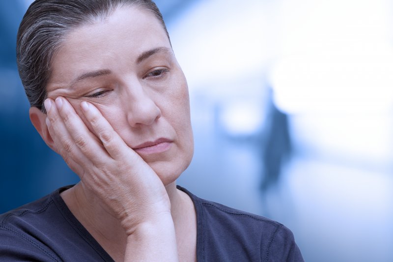 woman appearing exhausted and older